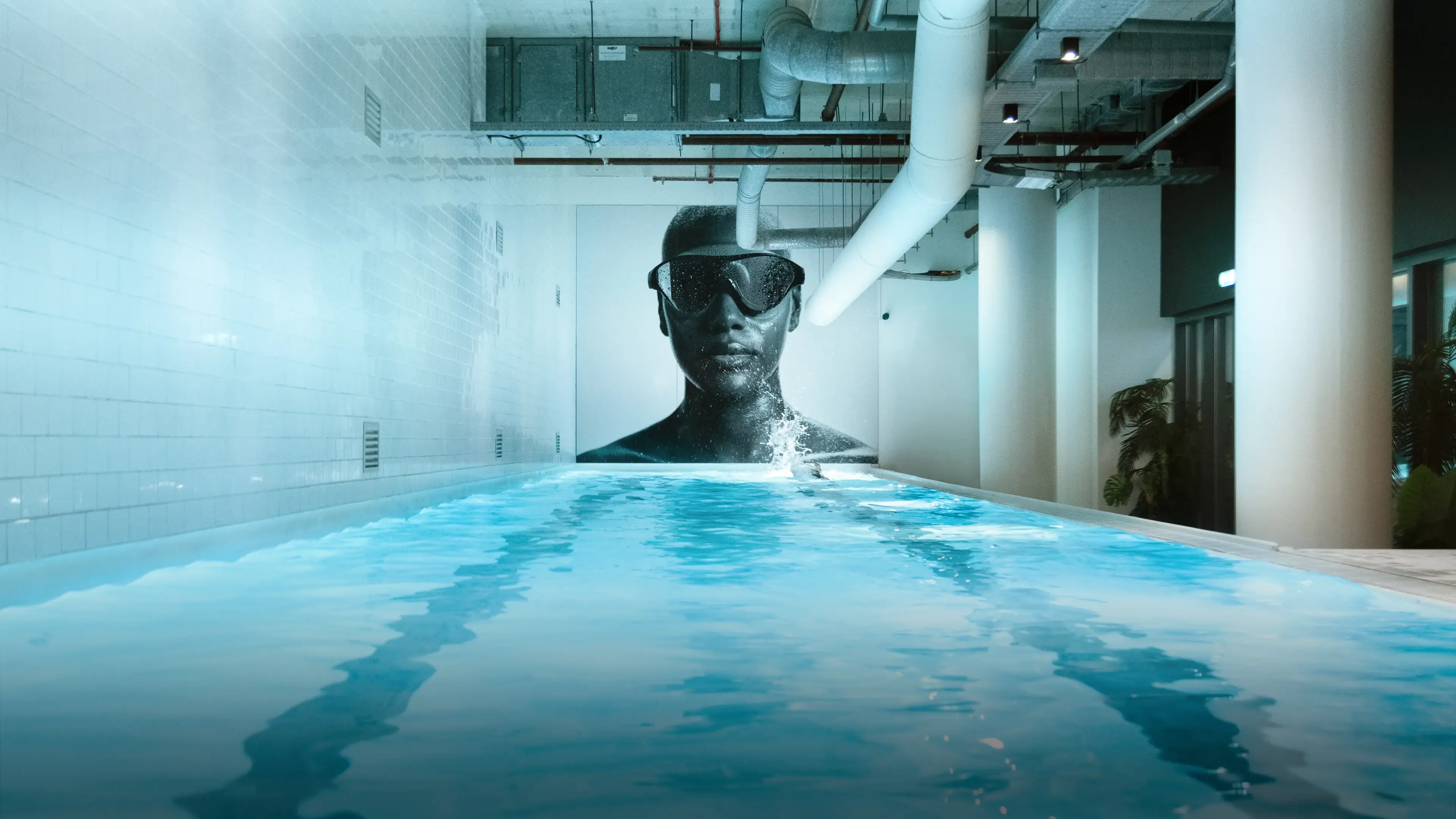 Clubsportive Amsterdam — indoor pool with swimmer mural